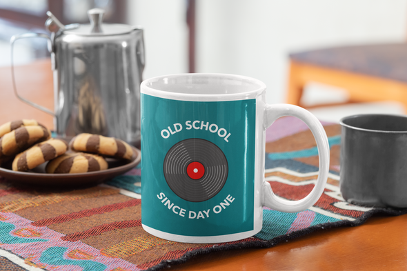 Coffee mug mockup with chocolate cookies says OLD SCHOOL SINCE DAY ONE