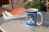 coffee mug on table next to books has a female pilot and says GIRLS CAN FLY