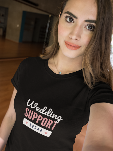 beautiful woman taking a selfie wearing a t-shirt that says Wedding Support Squad