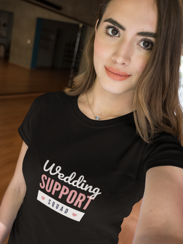 beautiful woman taking a selfie wearing a t-shirt that says Wedding Support Squad