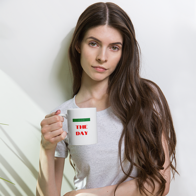 Sad looking woman holding a mug that says cease the day