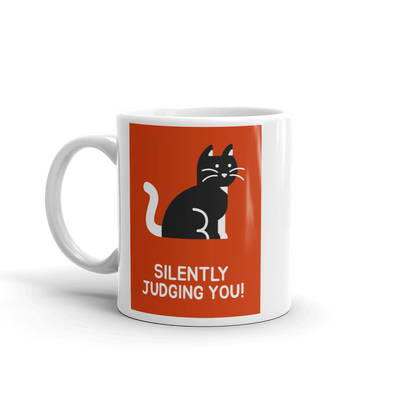 coffee mug with cat on orange background says SILENTLY JUDGING YOU