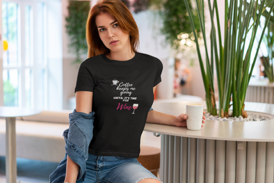beautuful woman at a coffee shop wearing t-shirt that says coffee keeps me going until it's time for wine
